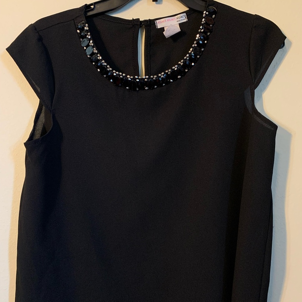 sleeveless dressy blouse with black gems around collar